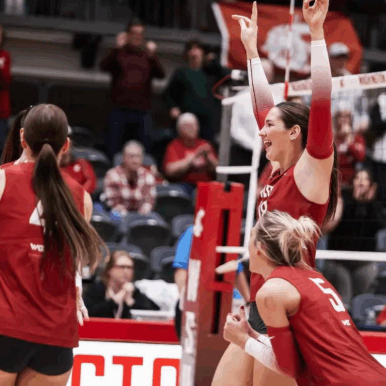 WSU volleyball students celebrating.